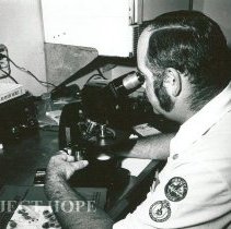 Jerry Smith, Cytologist, working at the microscope.